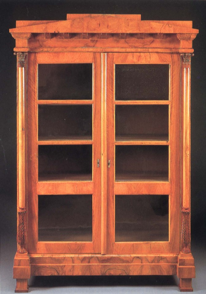 19th Century AUSTRIAN, Biedermeier Black Walnut Bookcase, 1800-1825
Walnut, 78 x 51 5/8 x 20 1/2 in. (198.1 x 131.1 x 52.1 cm)
Peaked pediment and dentiled dornice above a pair of glazed cupboard doors opening to shelves flanked by collumnar supportw with acanthus-carved capitals and terminal raised on block feet
BIE-004-FU
$19,500